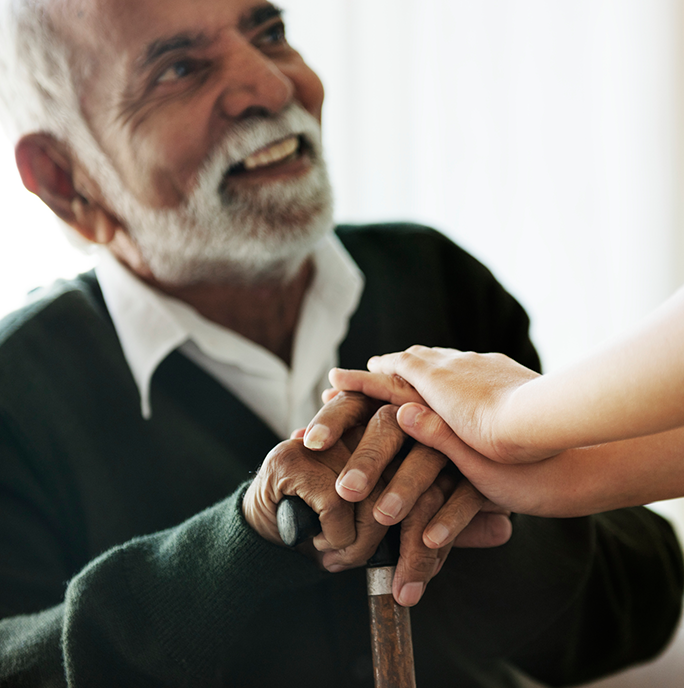 man holding grandson's hands