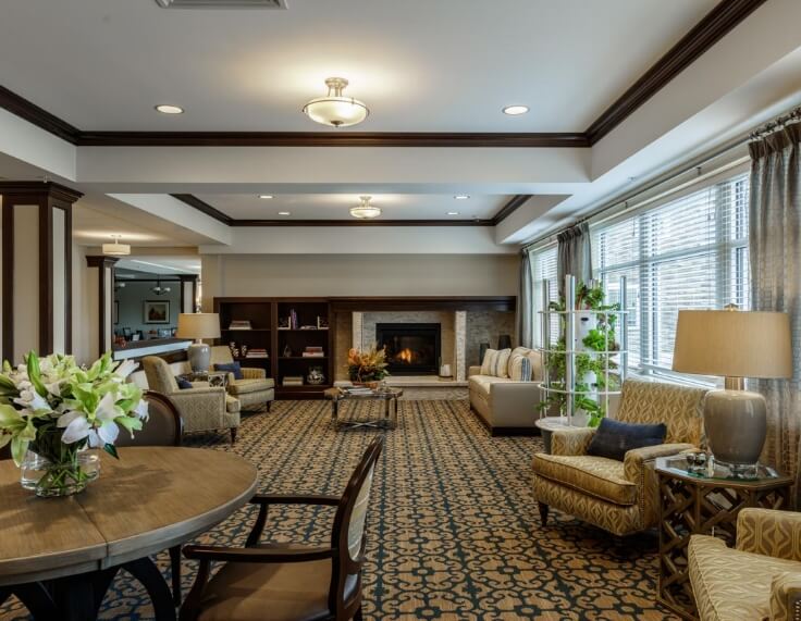 Community seating area with cozy fireplace and comfortable seating