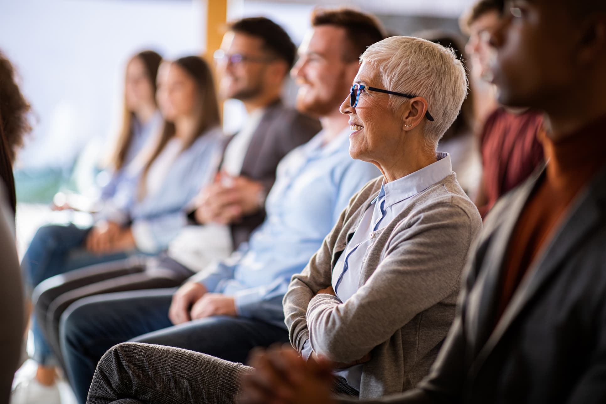 Room of people listening to a presentation